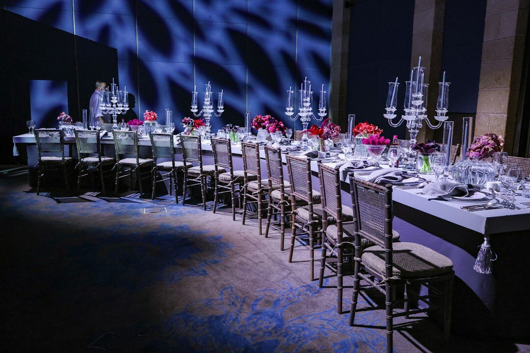 Corporate gala event with elegant seating and stage lighting