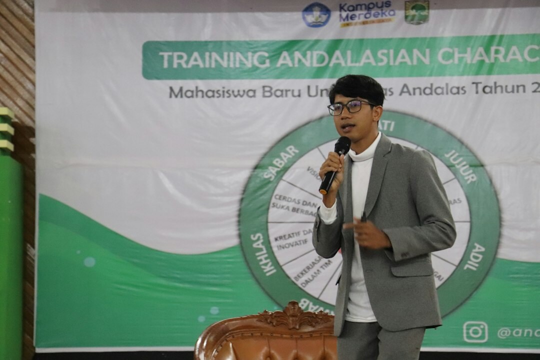 Moderator leading a training workshop for professionals in a bright room